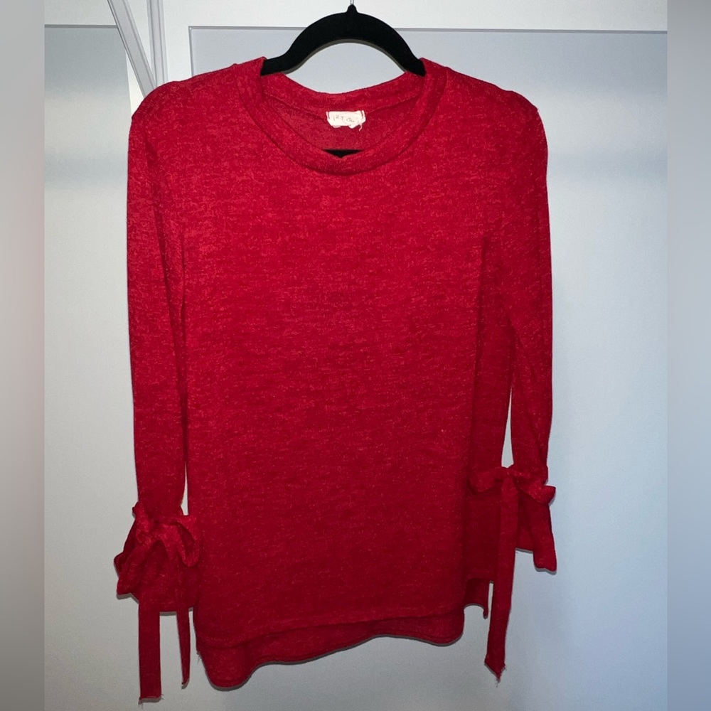 Red sweater with bow tie sleeves